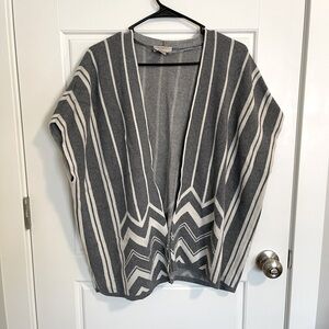 Gray and white poncho style cardigan.